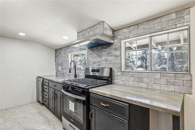 1850 Pond, Big Bear City, CA 92314 - kitchen featuring appliances with stainless steel finishes, a sink, decorative backsplash, wall chimney range hood, and light marble finish floors
