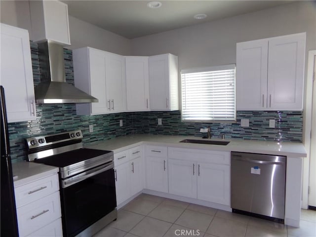 12612 Maui Way, Desert Hot Springs, CA 92240 - kitchen featuring appliances with stainless steel finishes, a sink, wall chimney range hood, light tile patterned floors, and backsplash