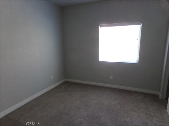 12612 Maui Way, Desert Hot Springs, CA 92240 - spare room with carpet flooring and baseboards