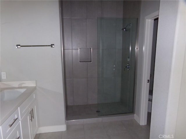 12612 Maui Way, Desert Hot Springs, CA 92240 - full bath with vanity, a stall shower, baseboards, and tile patterned flooring