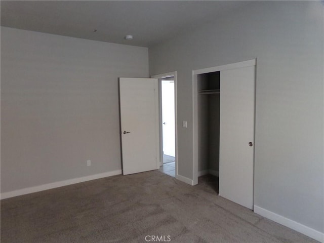 12612 Maui Way, Desert Hot Springs, CA 92240 - unfurnished bedroom with carpet floors, a closet, and baseboards