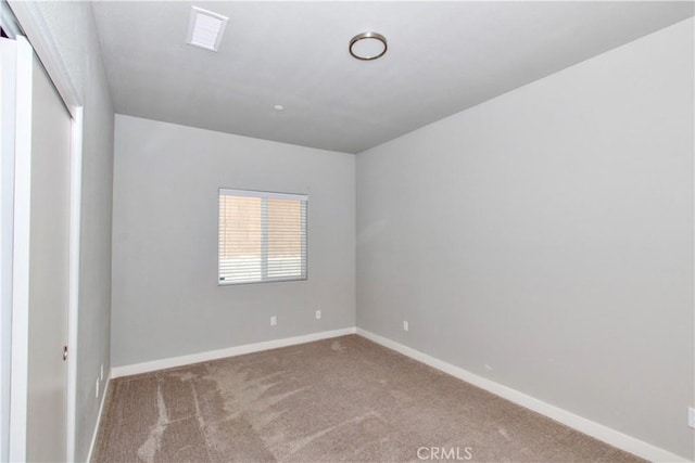 12612 Maui Way, Desert Hot Springs, CA 92240 - spare room featuring carpet flooring and baseboards