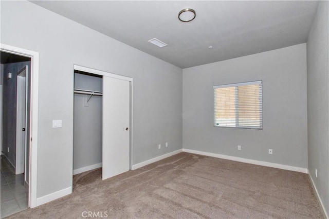 12612 Maui Way, Desert Hot Springs, CA 92240 - unfurnished bedroom featuring carpet flooring, a closet, and baseboards
