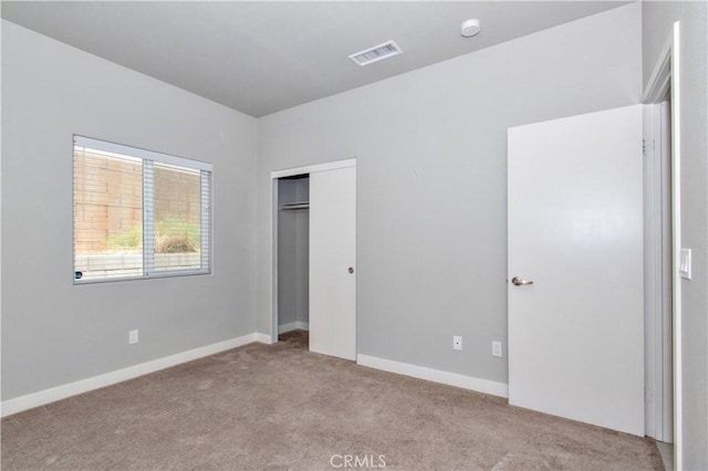12612 Maui Way, Desert Hot Springs, CA 92240 - unfurnished bedroom with carpet flooring, a closet, and baseboards