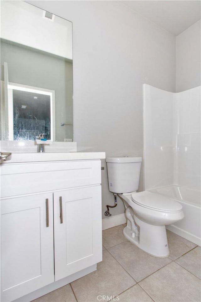 12612 Maui Way, Desert Hot Springs, CA 92240 - bathroom with tile patterned floors, toilet, vanity, baseboards, and bathtub / shower combination