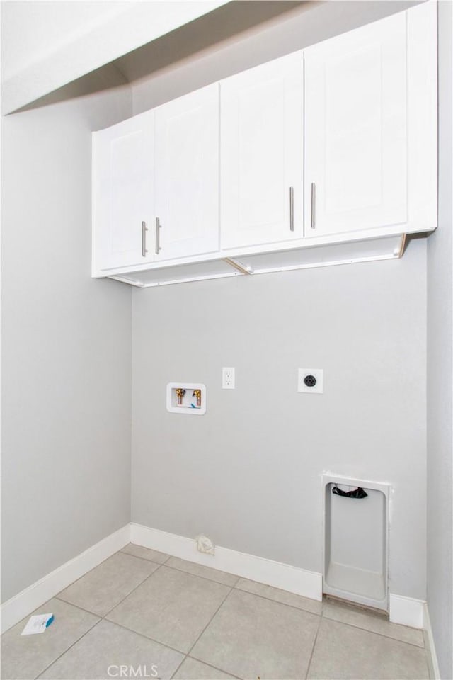 12612 Maui Way, Desert Hot Springs, CA 92240 - washroom with cabinet space, washer hookup, hookup for an electric dryer, and light tile patterned floors