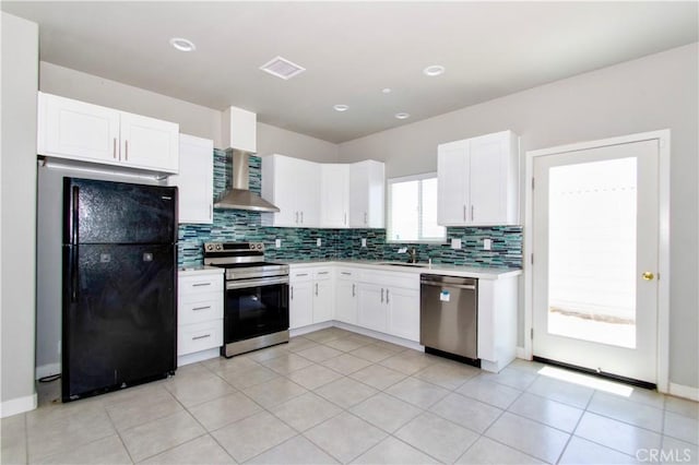 12612 Maui Way, Desert Hot Springs, CA 92240 - kitchen featuring appliances with stainless steel finishes, wall chimney exhaust hood, backsplash, white cabinets, and light countertops