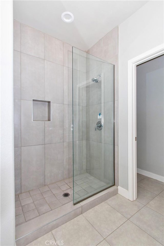 12612 Maui Way, Desert Hot Springs, CA 92240 - full bathroom featuring tile patterned floors, a tile shower, and baseboards