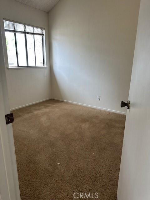 546 Northpoint Cir, Santa Maria, CA 93455 - carpeted spare room with baseboards and a textured ceiling