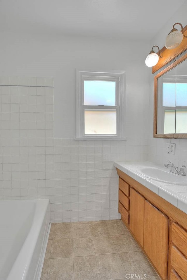 11206 Quinn St, Downey, CA 90241 - full bath with vanity, tile walls, a bath, and tile patterned floors