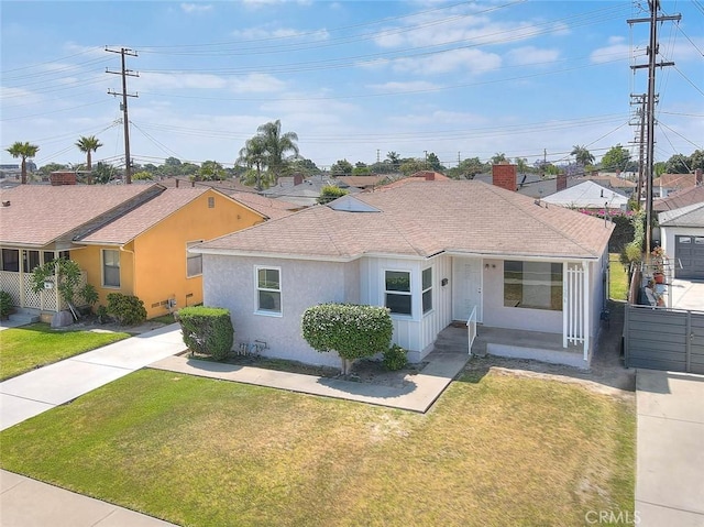 11206 Quinn St, Downey, CA 90241 - view of front of house with roof with shingles, stucco siding, and a chimney