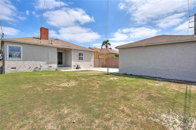 11206 Quinn St, Downey, CA 90241 - back of property with stucco siding, a patio, and a chimney