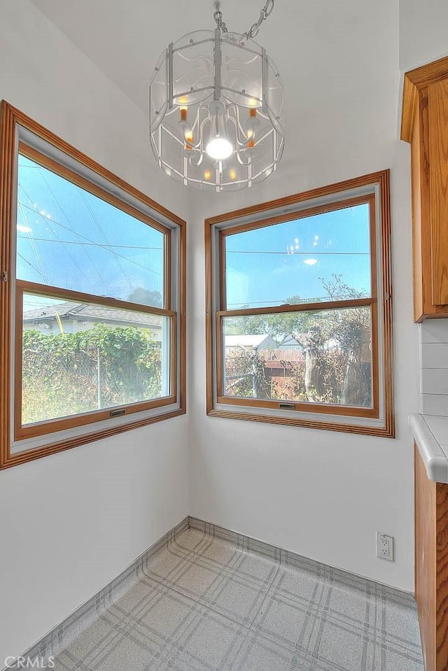 11206 Quinn St, Downey, CA 90241 - unfurnished dining area with a chandelier
