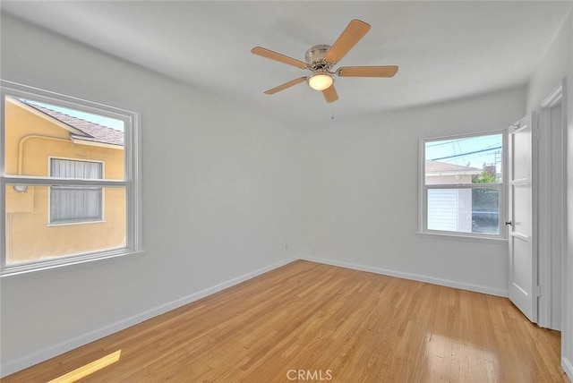 11206 Quinn St, Downey, CA 90241 - spare room featuring light wood-style floors, baseboards, and ceiling fan