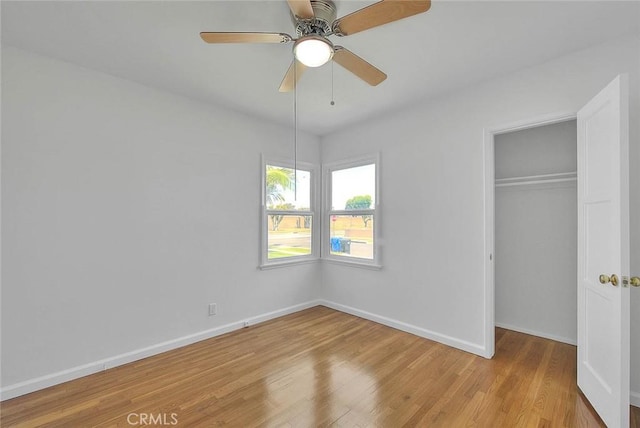 11206 Quinn St, Downey, CA 90241 - unfurnished bedroom with light wood finished floors, a closet, baseboards, and ceiling fan