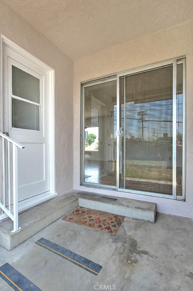 11206 Quinn St, Downey, CA 90241 - doorway to property with stucco siding