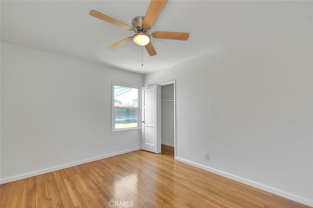 11206 Quinn St, Downey, CA 90241 - unfurnished bedroom featuring baseboards, light wood-type flooring, a closet, and a ceiling fan