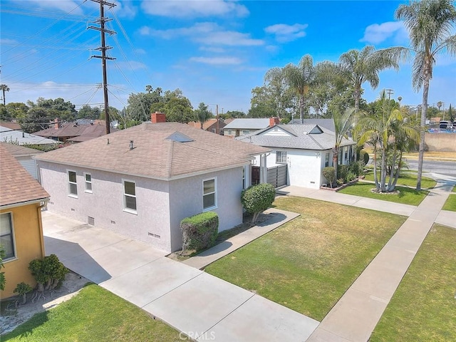 11206 Quinn St, Downey, CA 90241 - view of side of home with stucco siding, a shingled roof, a yard, a residential view, and driveway