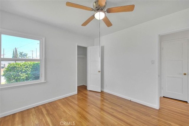 11206 Quinn St, Downey, CA 90241 - unfurnished bedroom featuring light wood-style floors, baseboards, a closet, and ceiling fan