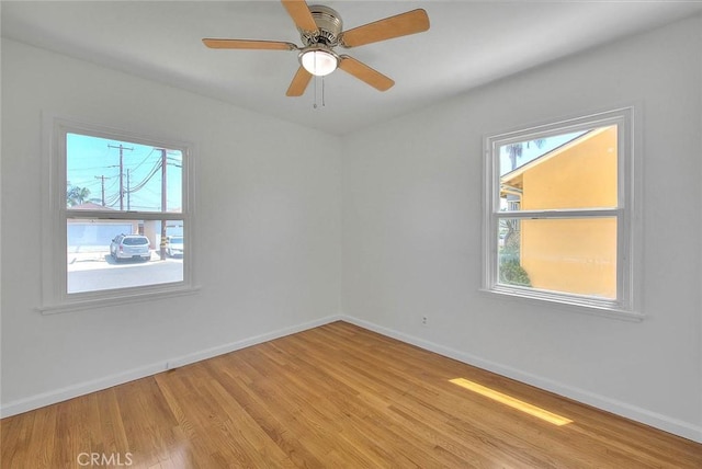 11206 Quinn St, Downey, CA 90241 - spare room with light wood-style flooring, baseboards, and a ceiling fan