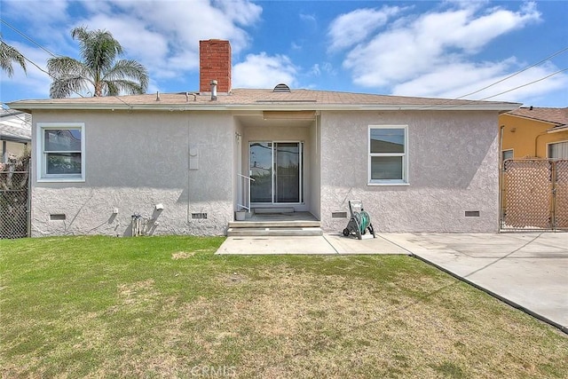 11206 Quinn St, Downey, CA 90241 - back of house with crawl space, stucco siding, a chimney, and a patio area