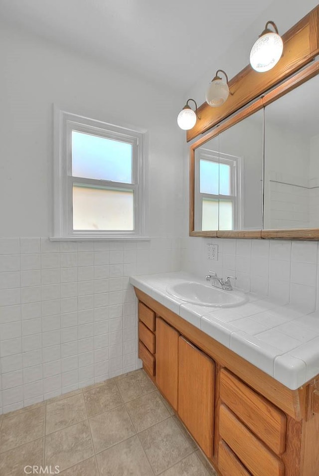 11206 Quinn St, Downey, CA 90241 - bathroom featuring healthy amount of natural light, vanity, and tile patterned flooring