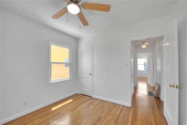 11206 Quinn St, Downey, CA 90241 - unfurnished bedroom with light wood-type flooring, baseboards, and ceiling fan