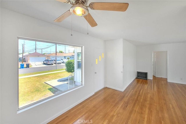 11206 Quinn St, Downey, CA 90241 - unfurnished living room featuring wood finished floors, baseboards, and a ceiling fan