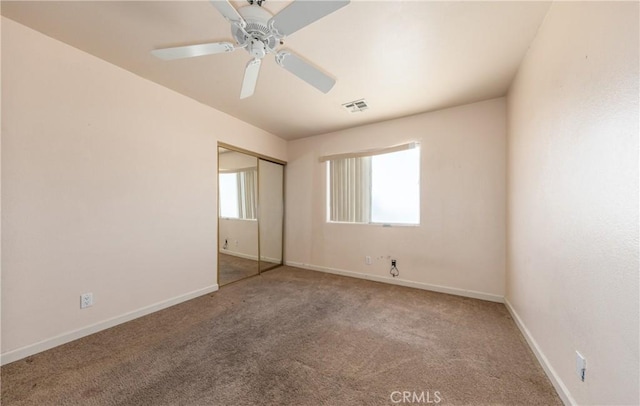66427 3rd St, Desert Hot Springs, CA 92240 - unfurnished bedroom with carpet floors, a closet, baseboards, and ceiling fan