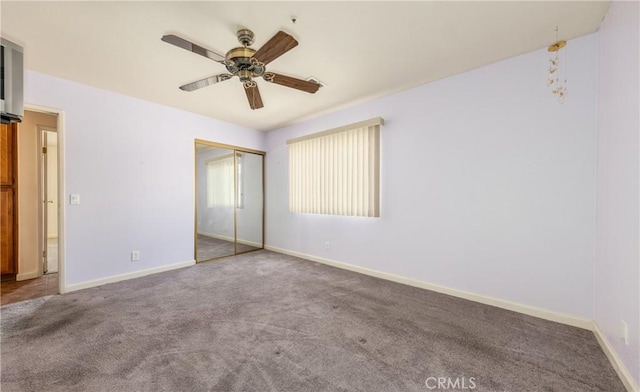 66427 3rd St, Desert Hot Springs, CA 92240 - unfurnished bedroom featuring carpet floors, a closet, baseboards, and a ceiling fan