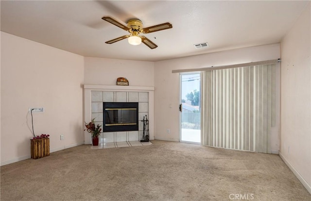 66427 3rd St, Desert Hot Springs, CA 92240 - unfurnished living room with ceiling fan, carpet flooring, a fireplace, and baseboards