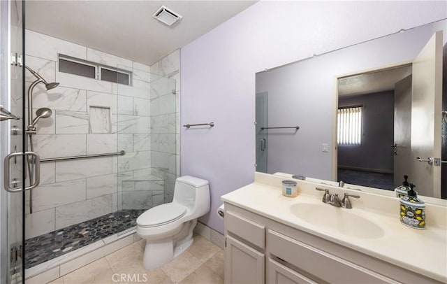 66427 3rd St, Desert Hot Springs, CA 92240 - bathroom featuring a shower stall, toilet, vanity, and baseboards
