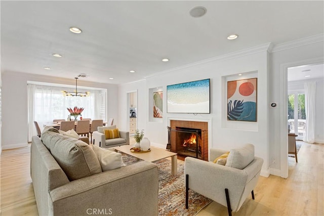 4901 Ethel Ave, Sherman Oaks, CA 91423 - living area featuring ornamental molding, light wood-type flooring, plenty of natural light, baseboards, and a chandelier