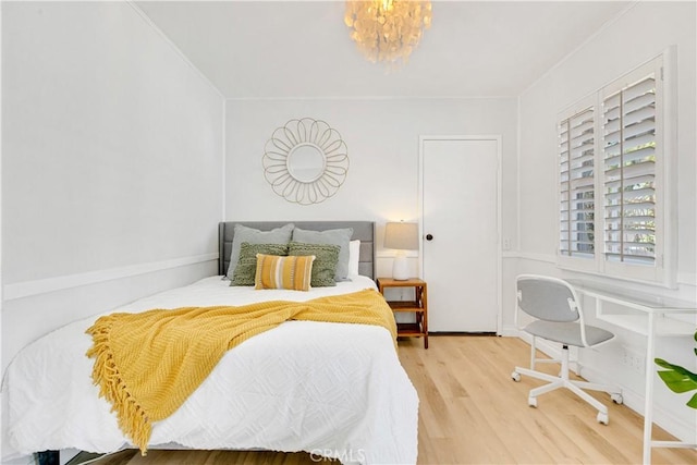 4901 Ethel Ave, Sherman Oaks, CA 91423 - bedroom featuring wood finished floors and a chandelier