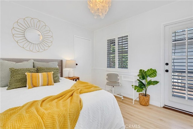 4901 Ethel Ave, Sherman Oaks, CA 91423 - bedroom featuring wood finished floors and a chandelier