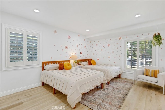 4901 Ethel Ave, Sherman Oaks, CA 91423 - bedroom with wood finished floors, multiple windows, baseboards, wallpapered walls, and recessed lighting