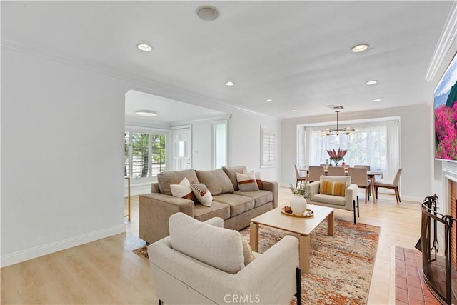 4901 Ethel Ave, Sherman Oaks, CA 91423 - living room featuring ornamental molding, a chandelier, recessed lighting, baseboards, and light wood-style flooring