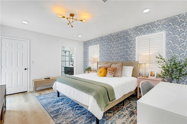 4901 Ethel Ave, Sherman Oaks, CA 91423 - bedroom featuring wallpapered walls, an accent wall, wood finished floors, and recessed lighting