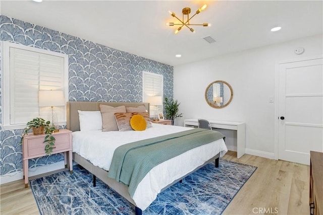 4901 Ethel Ave, Sherman Oaks, CA 91423 - bedroom featuring wallpapered walls, an accent wall, baseboards, wood finished floors, and recessed lighting