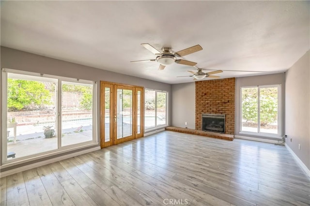 6114 Sard St, Rancho Cucamonga, CA 91701 - unfurnished living room with ceiling fan, wood finished floors, a fireplace, and baseboards