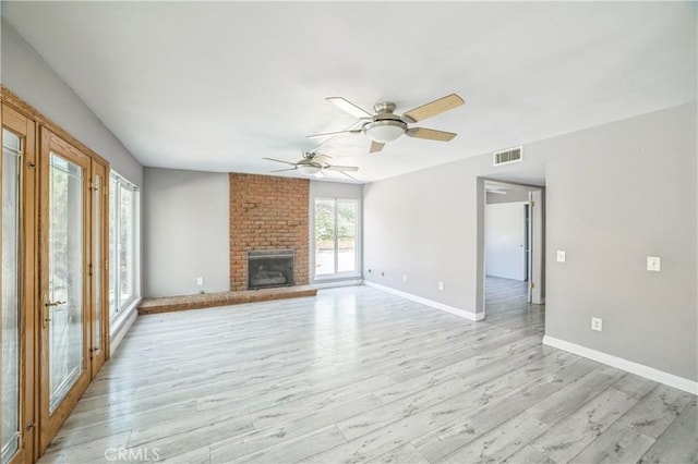 6114 Sard St, Rancho Cucamonga, CA 91701 - unfurnished living room featuring a ceiling fan, baseboards, light wood-style flooring, and a brick fireplace