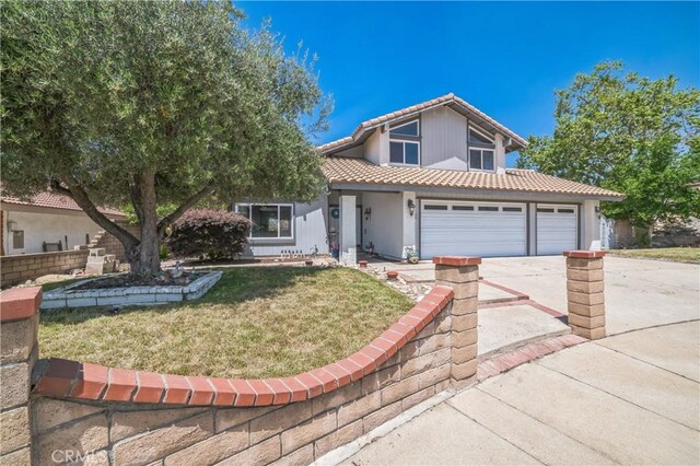 6114 Sard St, Rancho Cucamonga, CA 91701 - traditional-style house featuring a tile roof, driveway, a front yard, an attached garage, and stucco siding