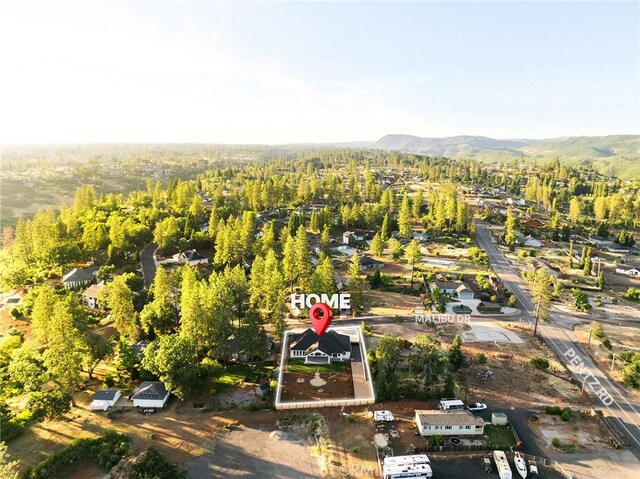 4956 Malibu Dr, Paradise, CA 95969 - aerial view of property and surrounding area with a forest and mountains