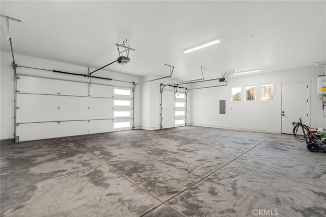 4956 Malibu Dr, Paradise, CA 95969 - garage with a garage door opener, electric panel, and water heater