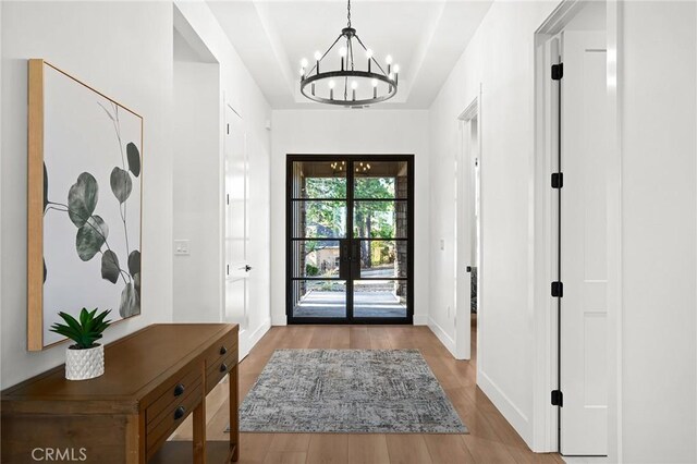 4956 Malibu Dr, Paradise, CA 95969 - entryway featuring a chandelier, wood finished floors, and baseboards
