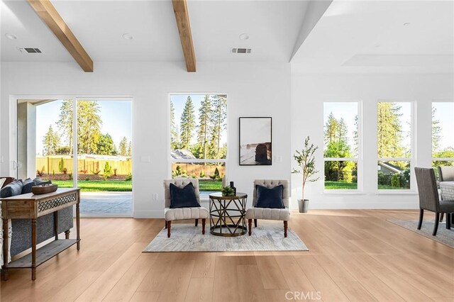 4956 Malibu Dr, Paradise, CA 95969 - sitting room featuring beam ceiling, light wood finished floors, baseboards, and healthy amount of natural light