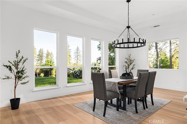 4956 Malibu Dr, Paradise, CA 95969 - dining area with a chandelier, plenty of natural light, light wood-style floors, and baseboards