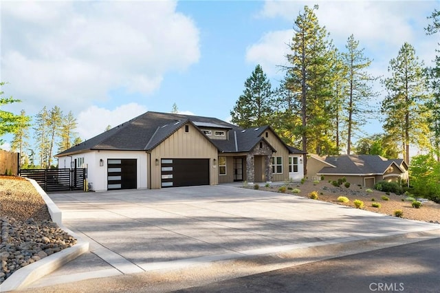 4956 Malibu Dr, Paradise, CA 95969 - contemporary house featuring a garage, concrete driveway, and board and batten siding
