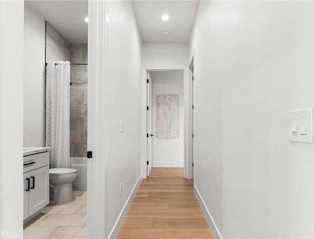 4956 Malibu Dr, Paradise, CA 95969 - corridor featuring recessed lighting, baseboards, and light wood-style flooring