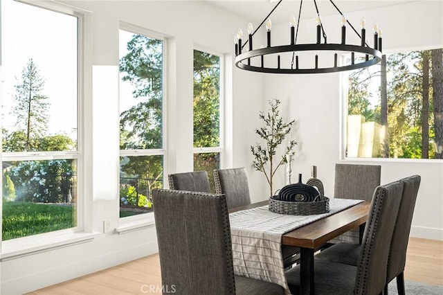 4956 Malibu Dr, Paradise, CA 95969 - dining area featuring wood finished floors and a chandelier